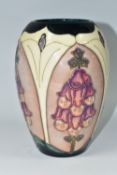 A MOORCROFT POTTERY 'FOXGLOVE' PATTERN TRIAL VASE, of ovoid form, tube lined with pink and purple