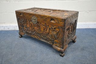 A 20TH CENTURY CAMPHORWOOD BLANKET CHEST, with detailed carving depicting ships, mountains, fish,