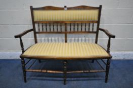 AN EDWARDIAN WALNUT AND INLAID TWO SEATER SOFA, with open armrests, turned supports, legs and