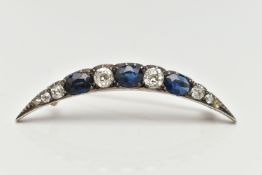 A LATE VICTORIAN DIAMOND AND SAPPHIRE CRESCENT BROOCH, set with three oval cut blue sapphires,
