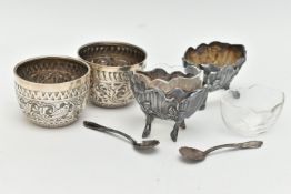 A PAIR OF VICTORIAN SILVER CIRCULAR SALTS, repoussé decorated with a band of birds, foliate