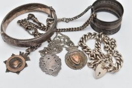 A SMALL ASSORTMENT OF SILVER, to include a silver hinged bangle, a double chain curb link