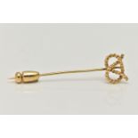 AN 18CT GOLD STAFFORDSHIRE KNOT STICK PIN, rope twist knot to a polished pin, hallmarked 18ct