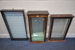 A 20TH CENTURY MAHOGANY COLLECTORS DISPLAY CABINET, with mirrored back, and seven glass shelves,