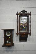 A 19TH CENTURY MAHOGANY AMERICAN WALL CLOCK, with foliate crest and two finials, the glazed door