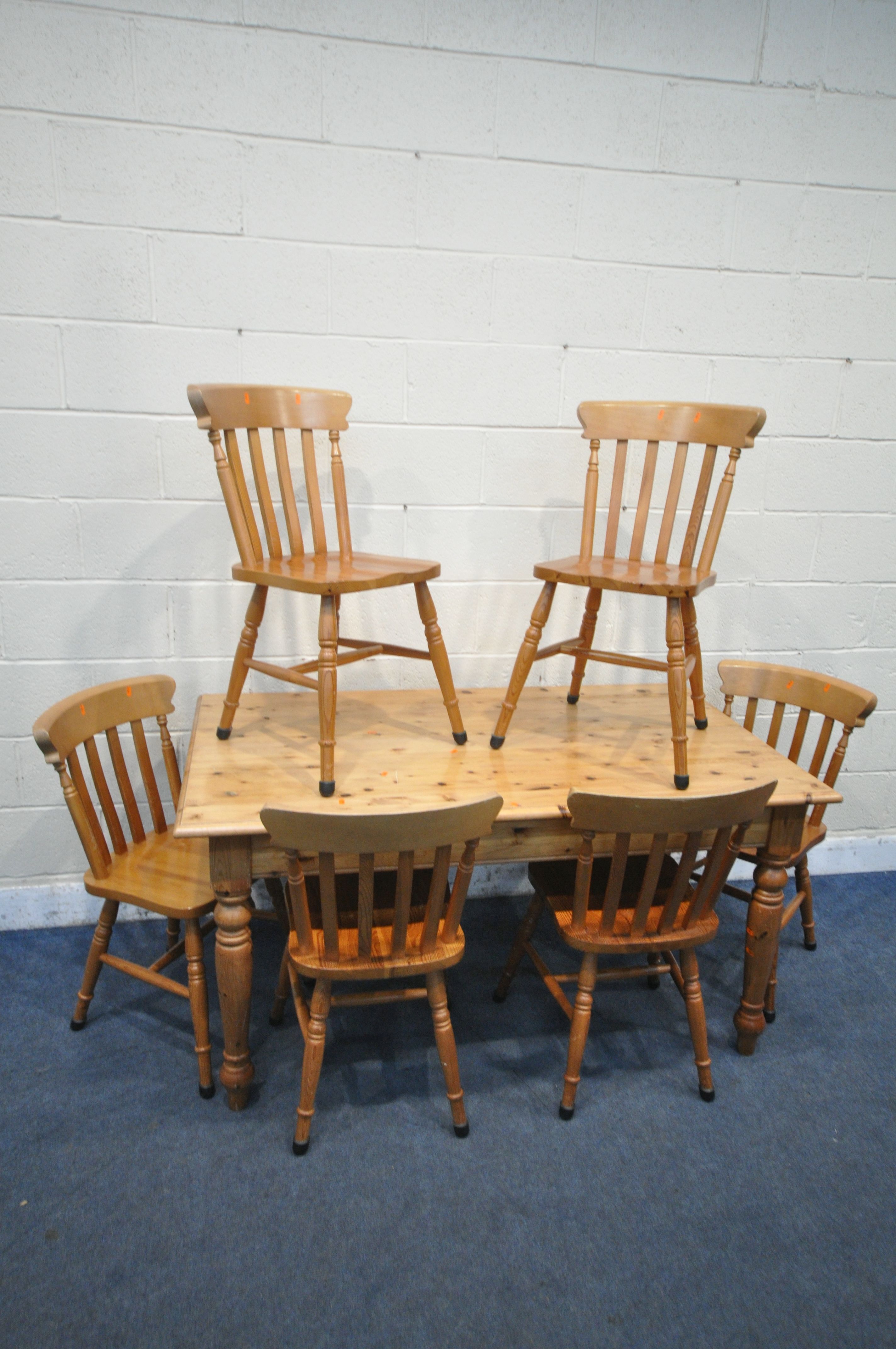 A MODERN PINE FARMHOUSE STYLE TABLE, with a single drawer to one end, on turned legs, length 150cm x