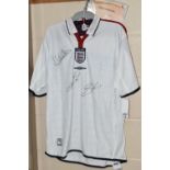 A SIGNED REPLICA ENGLAND MEN'S FOOTBALL SHIRT, signatures of David Beckham, Michael Owen and Sven