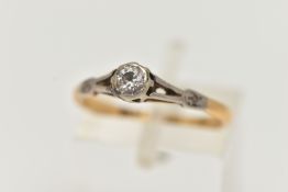 A YELLOW AND WHITE METAL SINGLE STONE DIAMOND RING, round brilliant cut diamond, collet set in a