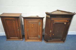 THREE PIECES OF GEORGIAN OAK FURNITURE, to include a corner cupboard, the single door enclosing