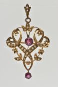 A YELLOW METAL LAVALIER PENDANT/BROOCH, open work scroll and floral pendant, set with a central