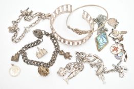 A SMALL ASSORTMENT OF WHITE METAL JEWELLERY, to include a cuff bangle, three charm bracelets, a