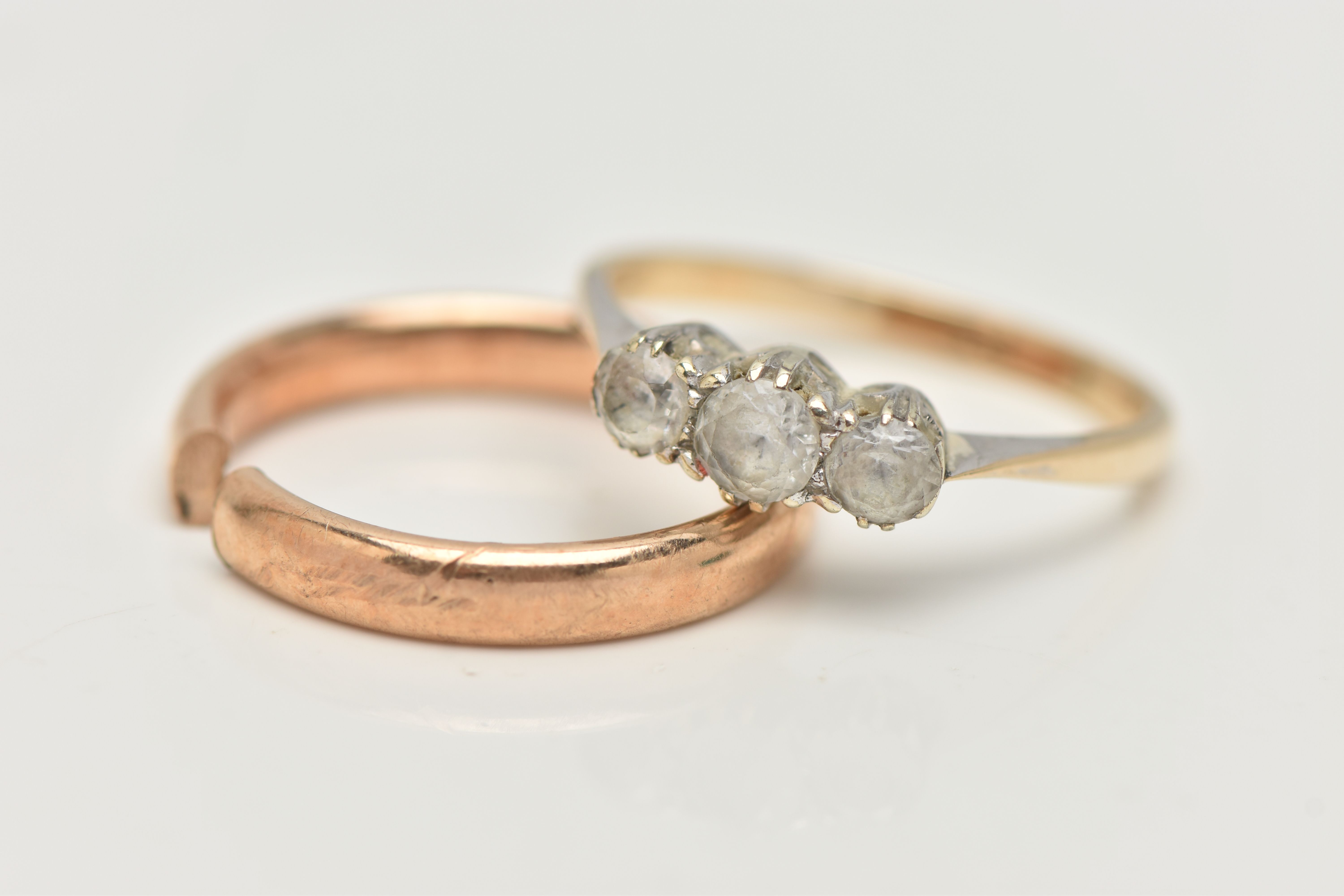 A YELLOW METAL THREE STONE RING, AND A BAND RING, the first a three stone colorless spinel ring, - Image 2 of 4