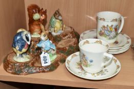 A BESWICK BEATRIX POTTER'S FIGURE STAND WITH FIVE CHARACTERS, comprising 'Squirrel Nutkin' gold gilt