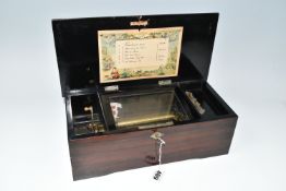 A SIMULATED ROSEWOOD SIX AIR MUSIC BOX, no visible makers marks, the comb and cylinder are intact