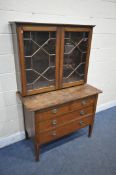 AN ARTS AND CRAFTS OAK CHEST OF TWO SHORT OVER TWO LONG DRAWERS, on tapered legs and square feet,