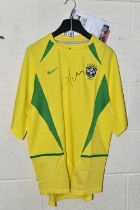 A BRAZIL REPLICA HOME FOOTBALL SHIRT SIGNED BY CAFU, signed to front in black felt pen, shirt in