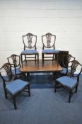 A 20TH CENTURY OAK WIND OUT DINING TABLE, with canted corners on turned legs, and an additional