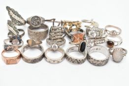 AN ASSORTMENT OF WHITE METAL RINGS, to include a signed 'Swarovski' band ring, sixteen white metal