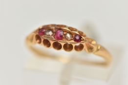 AN EARLY 20TH CENTURY RUBY AND DIAMOND BOAT RING, set with three small circular cut rubies,
