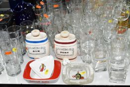 A LARGE COLLECTION OF BREWERIANA, comprising glasses, water jugs, decanters and ashtrays, four boxed