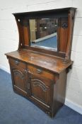 AN ARTS AND CRAFTS OAK MIRROR BACK SIDEBOARD, with central bevelled mirror, above two drawers and