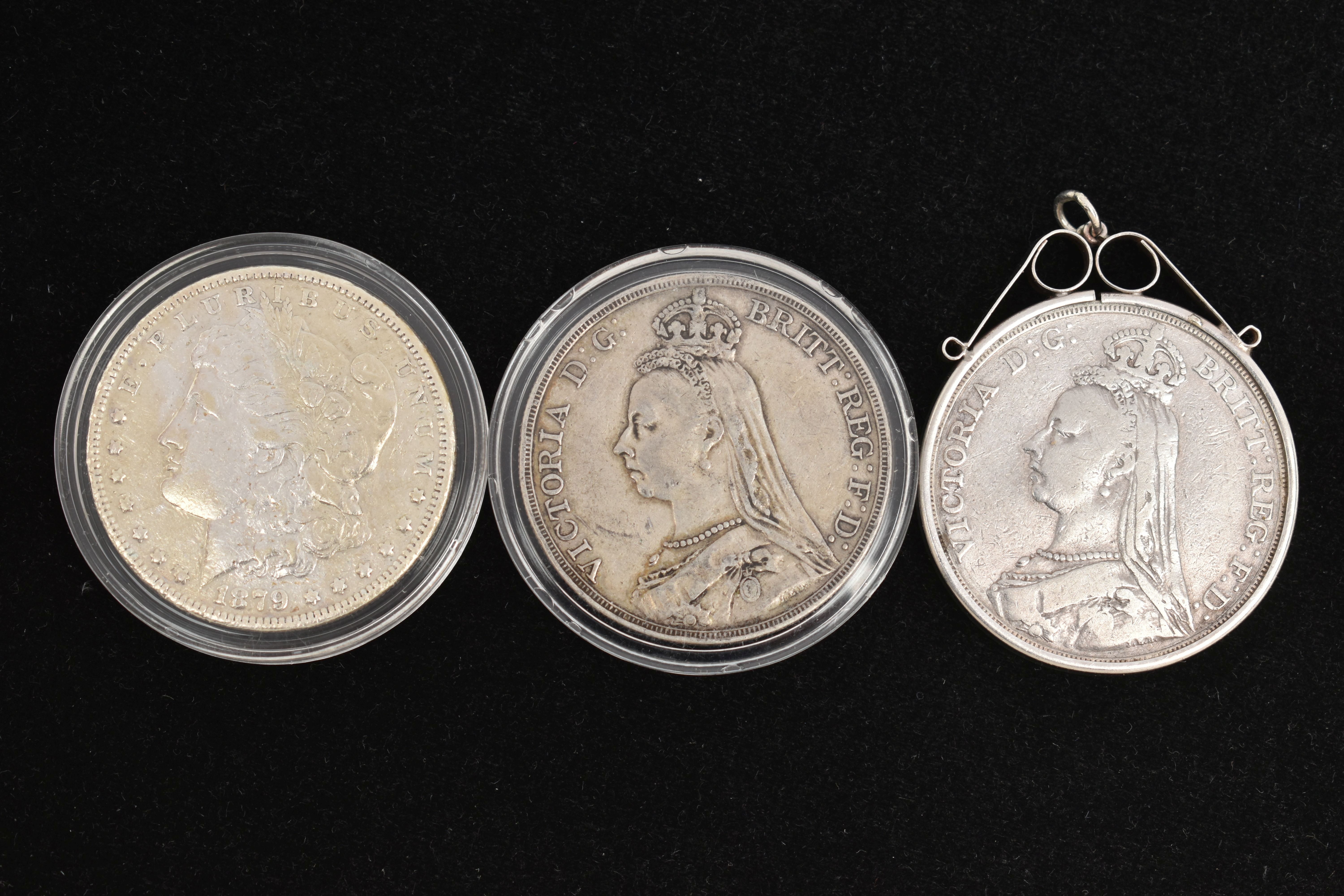 A PARCEL OF THREE SILVER COINS, to include an 1891 Crown coin in a silver mount, an 1889 Victoria