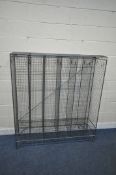 A WIRE MESH GYM LOCKER, with six tall sections and six small sections, on hair pin legs, width 138cm