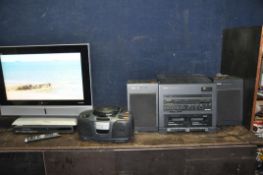 A SANYO CES26WSD7 26in TV with remote, a Sanyo DVD player (no remote), a Matsui portable Hi Fi and a
