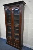 A LATE 19TH / EARLY 20TH CENTURY MAHOGANY BOOKCASE, with double glazed doors, and six adjustable
