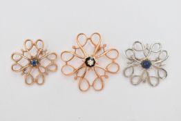 A COLLECTION OF THREE GEM SET BROOCHES, each brooch of openwork design, to include a 9ct rose gold