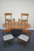 A MID CENTURY TEAK EXTENDING DINING TABLE, with a single fold out leaf, open length 181cm x diameter