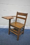 A 20TH CENTURY OAK SCHOOL CHAIR, with a right armrest which is also a desk, with slatted undershelf,