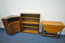 A 20TH CENTURY OAK BARLEY TWIST GATE LEG TABLE, an open bookcase and a mid-century teak corner