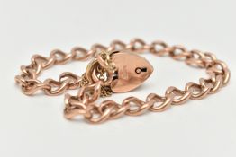A ROSE METAL CURB LINK BRACELET, solid curb links, most stamped 9.375, fitted with a yellow metal