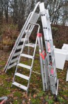 AN ALUMINIUM DOUBLE EXTENSION LADDER with 7 rungs to each 195cm length, four step ladders and a