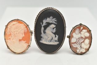 THREE CAMEO BROOCHES, the first a black Wedgewood cameo set in a white metal mount, unmarked,