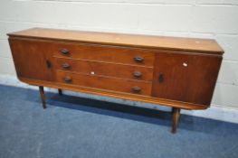 A MID CENTURY TEAK SIDEBOARD, fitted with two cupboard doors, flanking three drawers, on square