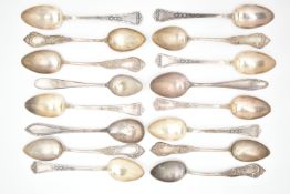 AN ASSORTMENT OF WHITE METAL SPOONS, sixteen white metal spoons, varying designs, fourteen spoons