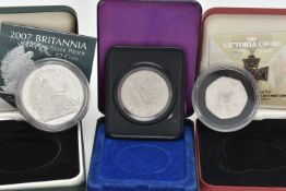 A GROUP OF THREE BOXED SILVER COINS, to include a Royal Mint The Victoria Cross Fifty Pence with