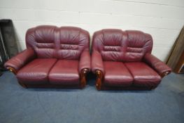 A PAIR OF BURGUNDY LEATHER TWO SEATER SOFAS, length 144cm x 90cm x height 100cm (condition report: