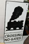 A CAST IRON ROAD/RAILWAY SIGN 'Crossing No Gates', with stylised image of steam locomotive, white