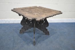 AN ANGLO INDIAN CARVED FOLDING TABLE, depicting leaves and other foliage, 79cm squared x height 59cm