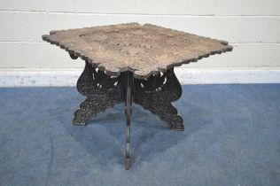 AN ANGLO INDIAN CARVED FOLDING TABLE, depicting leaves and other foliage, 79cm squared x height 59cm