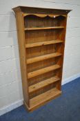 A MODERN PINE OPEN BOOKCASE, with five fixed shelves, width 97cm x depth 29cm x height 183cm (