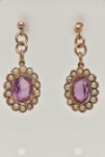 A PAIR OF EARLY 20TH CENTURY AMETHYST AND SEED PEARL DROP EARRINGS, each earring of an oval form set