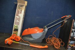 A FLYMO EASI GLIDE 300V ELECTRIC LAWN MOWER and a ZE strimmer with box ( both PAT fail due to