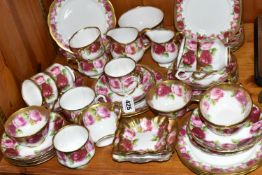 A ROYAL ALBERT 'OLD ENGLISH ROSE' 6241 PATTERN TEA SET AND SIMILAR, comprising milk jug, sugar bowl,