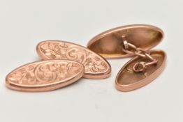 A PAIR OF EARLY 20TH CENTURY 9CT GOLD OVAL CUFFLINKS, oval foliate pattern panels, chain linked,