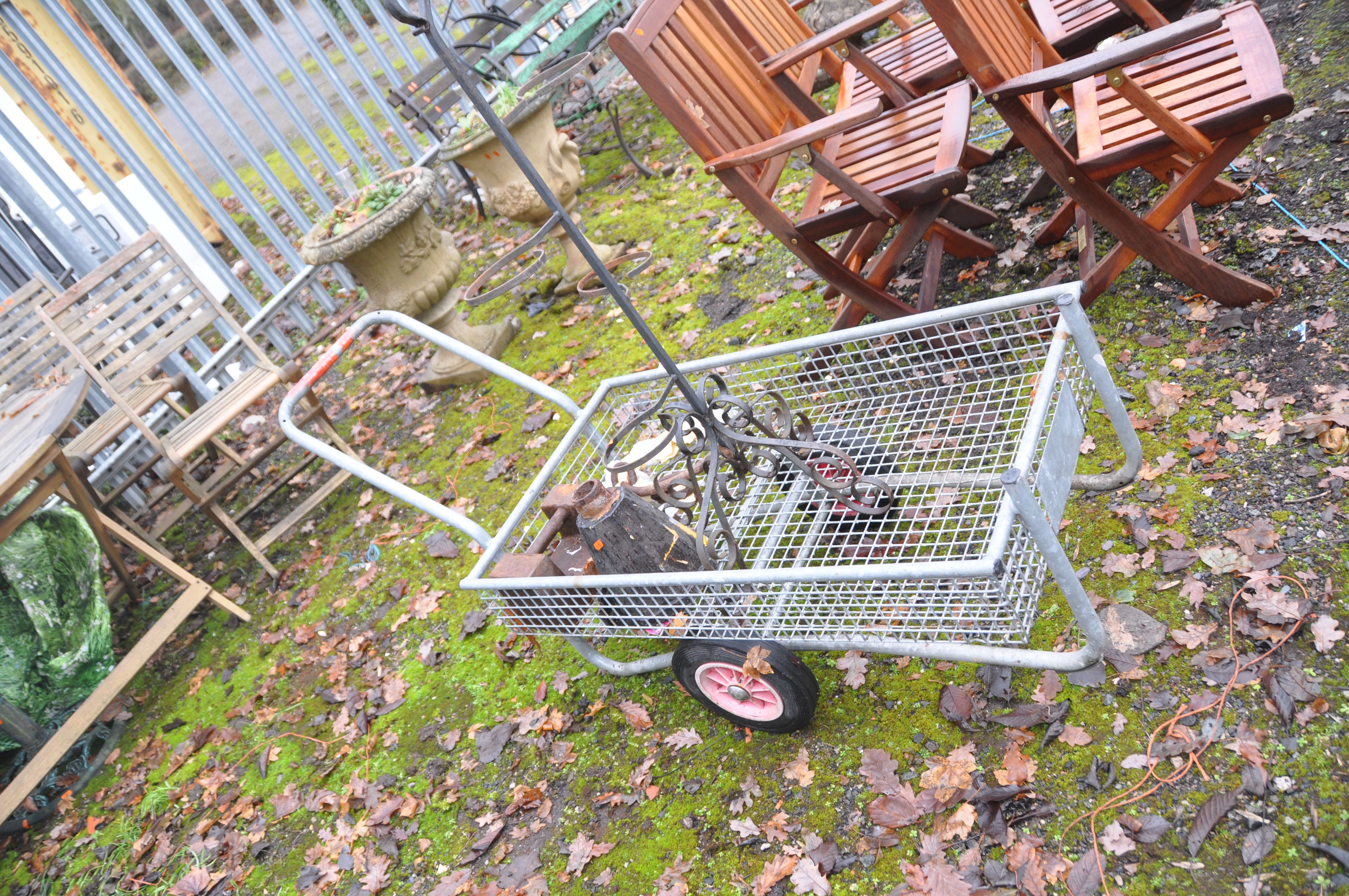 A GALVANISED STEEL GARDEN TROLLEY (basket length 100cm) a wrought iron plant stand, a vintage rain