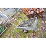 A GALVANISED STEEL GARDEN TROLLEY (basket length 100cm) a wrought iron plant stand, a vintage rain
